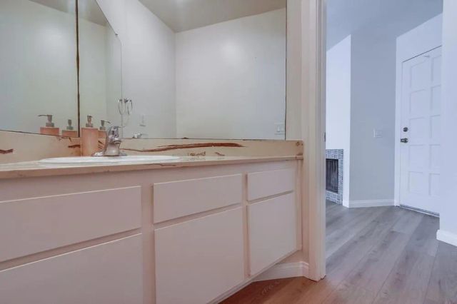 a bathroom with a sink and a mirror