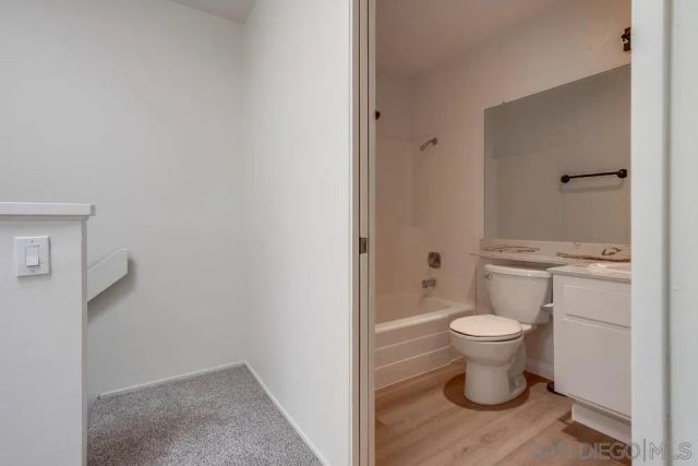 a bathroom with a toilet and a sink