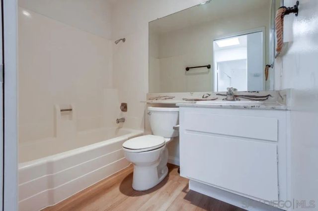 a bathroom with a sink a toilet and a bathtub
