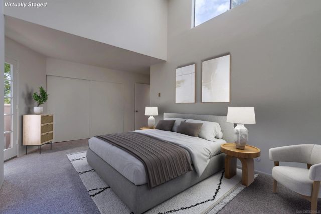 a bedroom with a bed and a couch