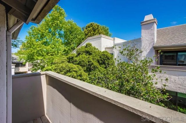 a view of a garden from a balcony