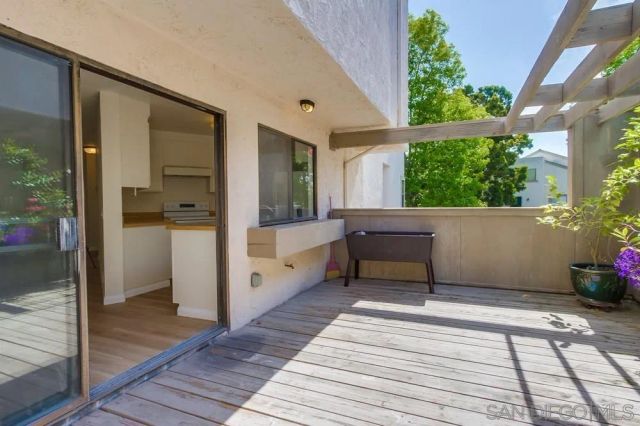 a backyard of a house with wooden floor and outdoor space