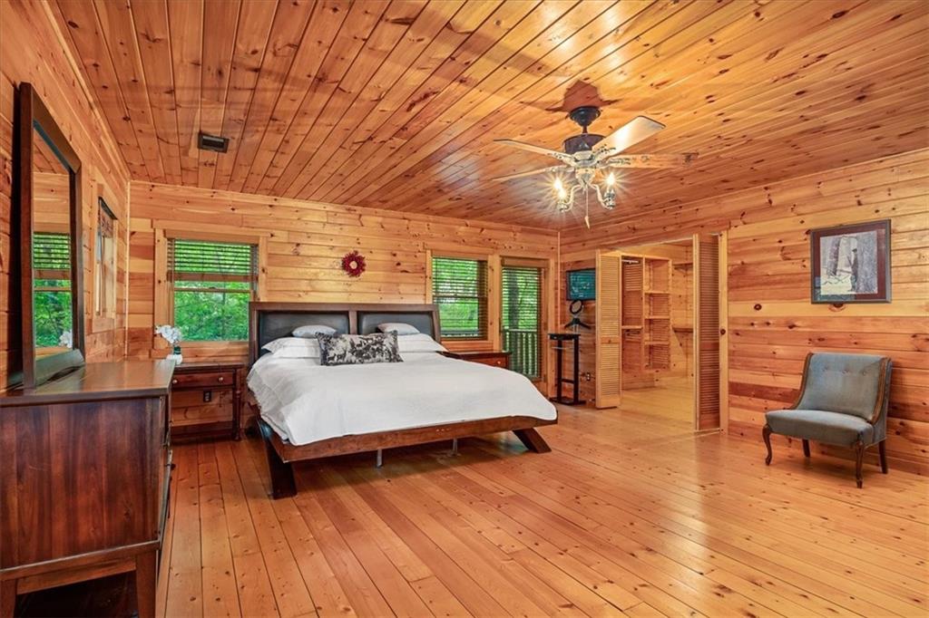 159 Brownsdale Road Butler, PA 16002 - Photo 29 of 50 a bedroom with a large bed a chandelier and dresser
