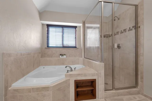 a bathroom with a bath tub and a sink