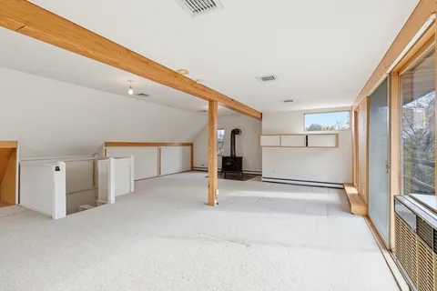 a view of a hallway with a white walls