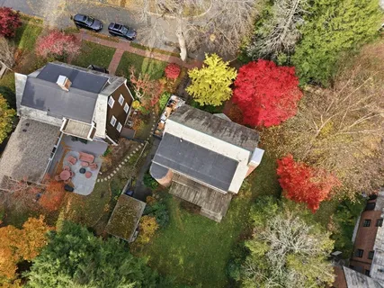 an aerial view of a house with a yard and garden