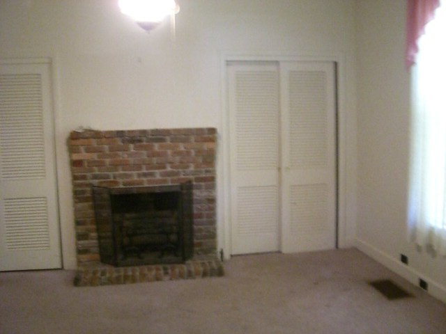 196 Glosson Road Gray, GA 31032 - Photo 14 of 40 an empty room with a fireplace