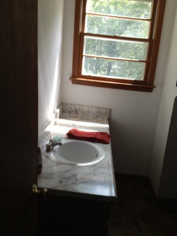 196 Glosson Road Gray, GA 31032 - Photo 24 of 40 a bathroom with a sink and a window