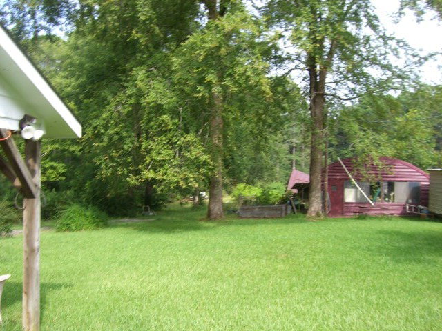 196 Glosson Road Gray, GA 31032 - Photo 33 of 40 a view of a house with a yard and sitting area