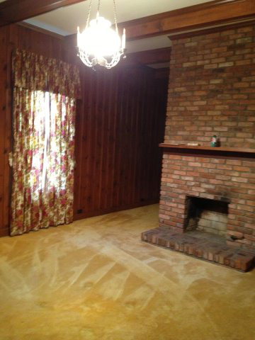 196 Glosson Road Gray, GA 31032 - Photo 8 of 40 a view of an empty room with a fireplace and a window