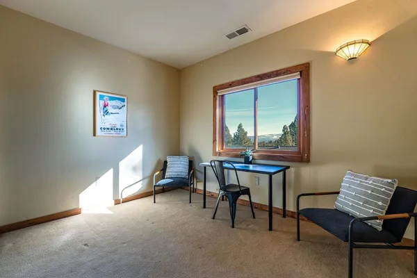 a workspace with furniture and window