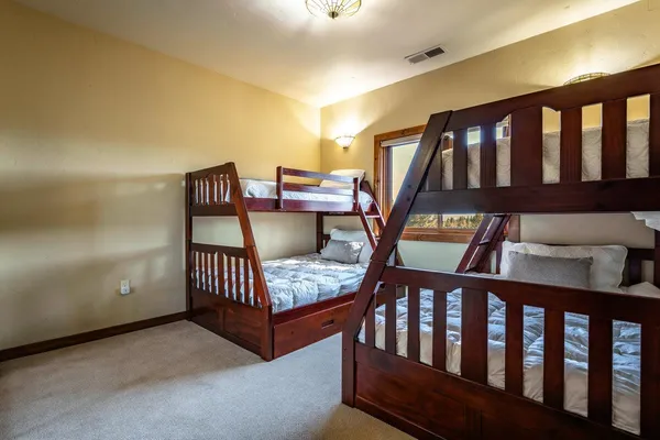 a bedroom with furniture and a window