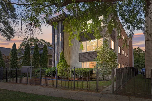 front view of a house with a tree