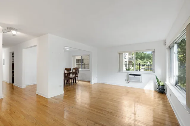 a view of dining room with furniture window and wooden floor