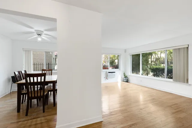 a view of a livingroom with furniture window and wooden floor