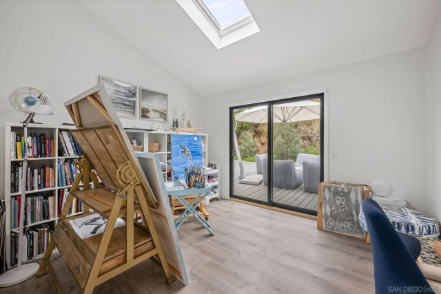 a view of a livingroom with furniture and staircase