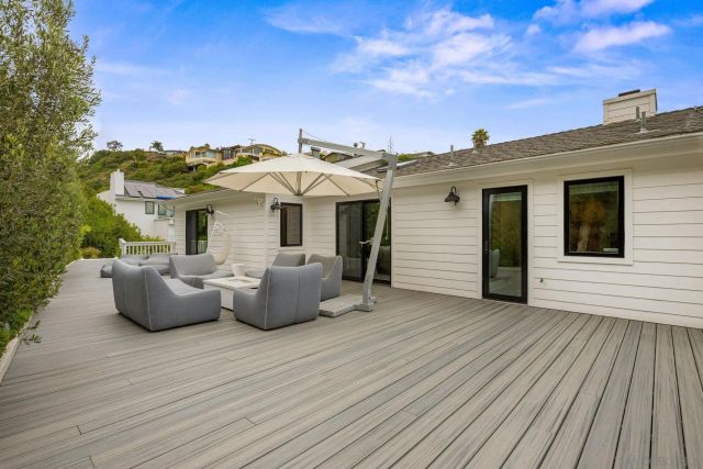a view of a roof deck with couches