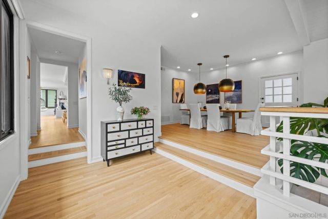 a view of a living room and dining room
