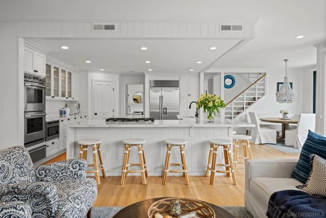 a view of kitchen and dining area with stainless steel appliances