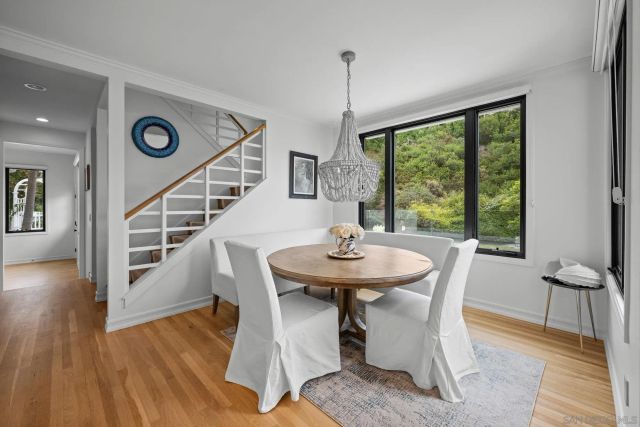 a dining room with furniture window wooden floor