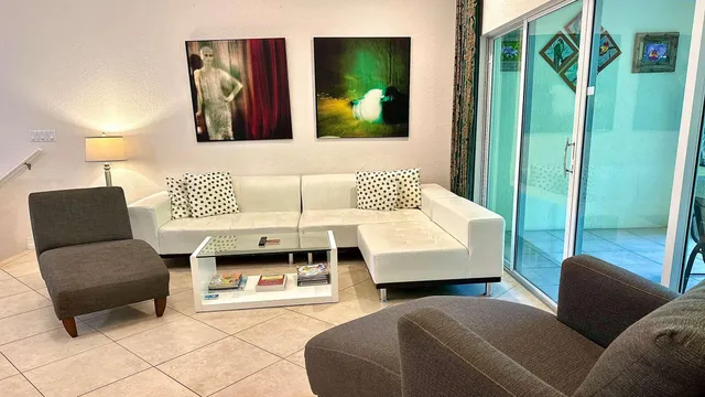 a view of a dining room with furniture and window