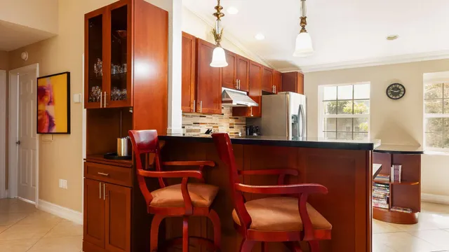 a bedroom with two beds and a flat screen tv