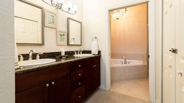 a view of a room with a table and chairs