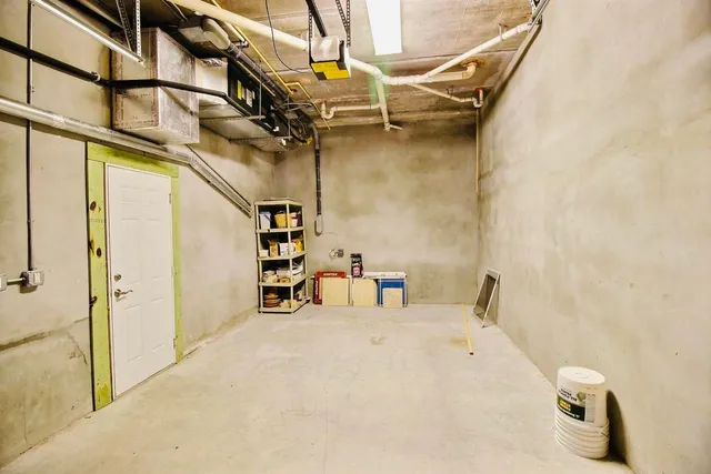 a view of a dining room with furniture and a potted plant