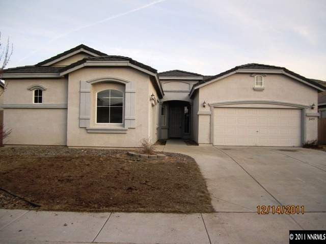 2495 Baton Drive Reno, NV 89521 - Photo 1 of 13 a front view of a house with garage