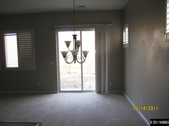 2495 Baton Drive Reno, NV 89521 - Photo 6 of 13 an empty room with windows and fan