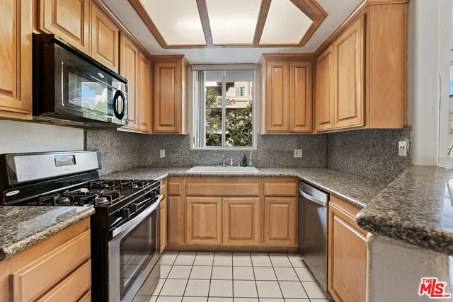 a kitchen with a stove and a microwave