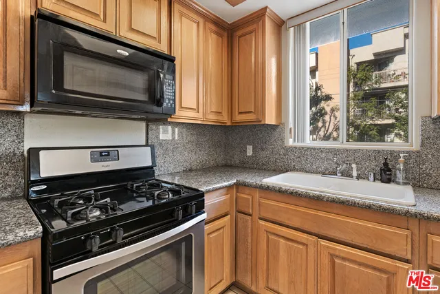 a view of cabinets with wooden floor