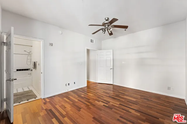 a view of a room with rack and wooden floor