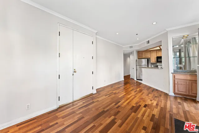 a view of hallway with wooden floor and fireplace