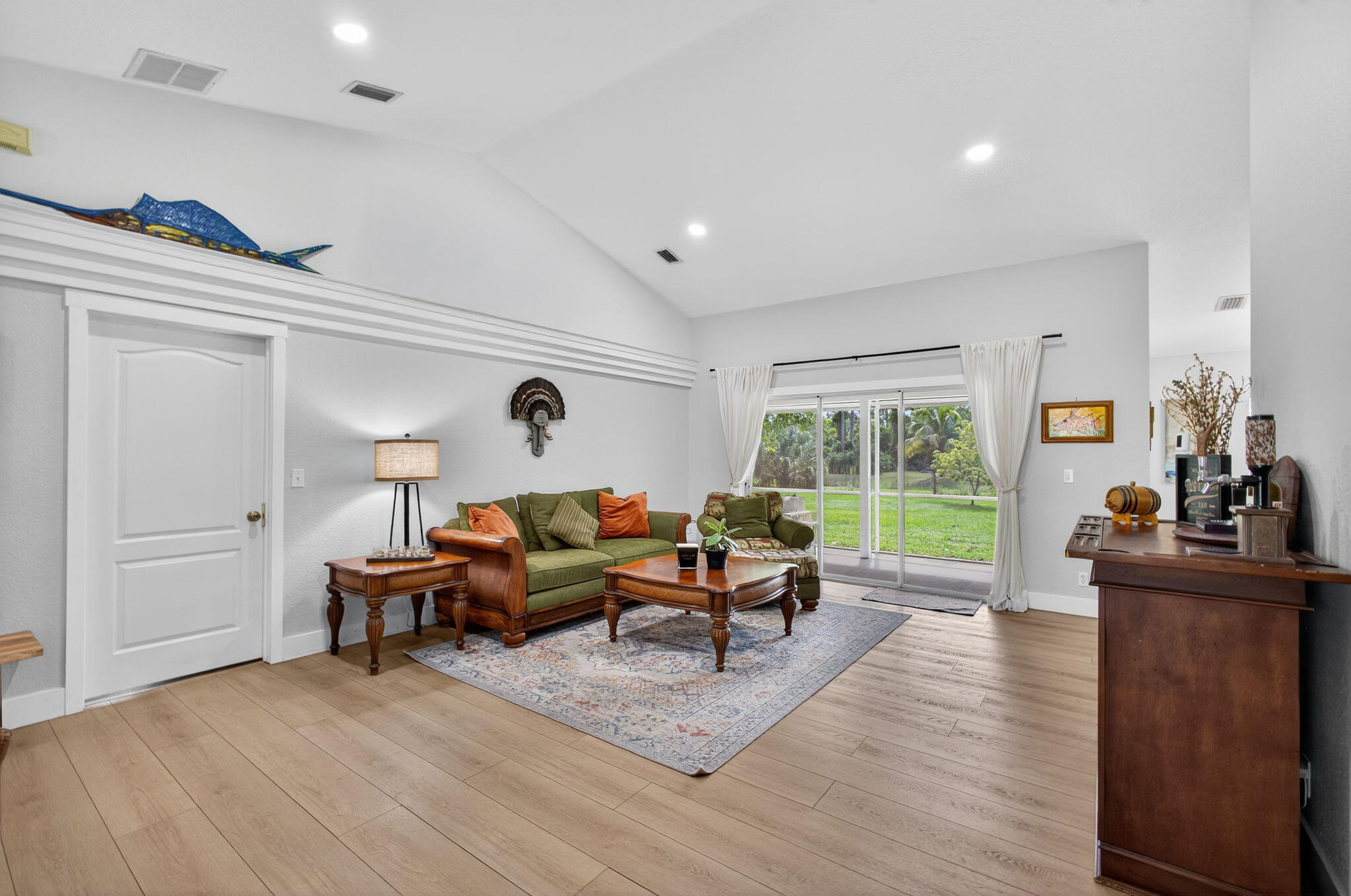 14366 76th Road North The Acreage, FL 33470 - Photo 13 of 76 a living room with furniture and a large window