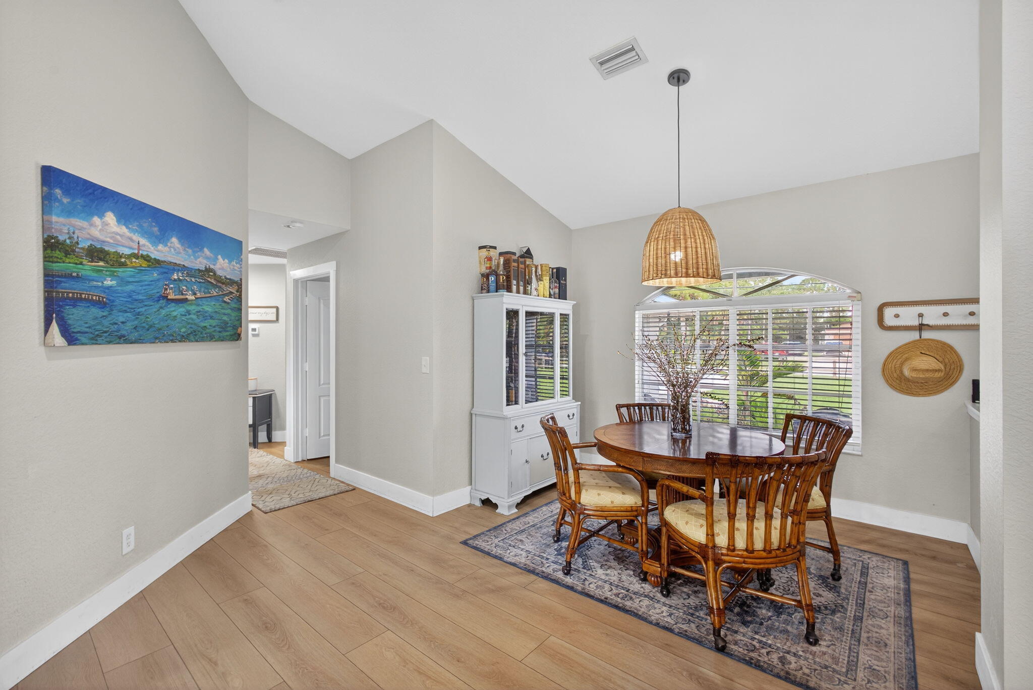 14366 76th Road North The Acreage, FL 33470 - Photo 17 of 76 a view of a dining room with furniture wooden floor and chandelier