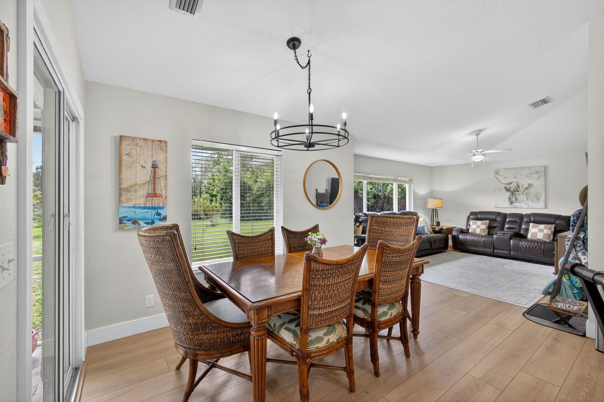 14366 76th Road North The Acreage, FL 33470 - Photo 23 of 76 a view of a dining room with furniture window and wooden floor
