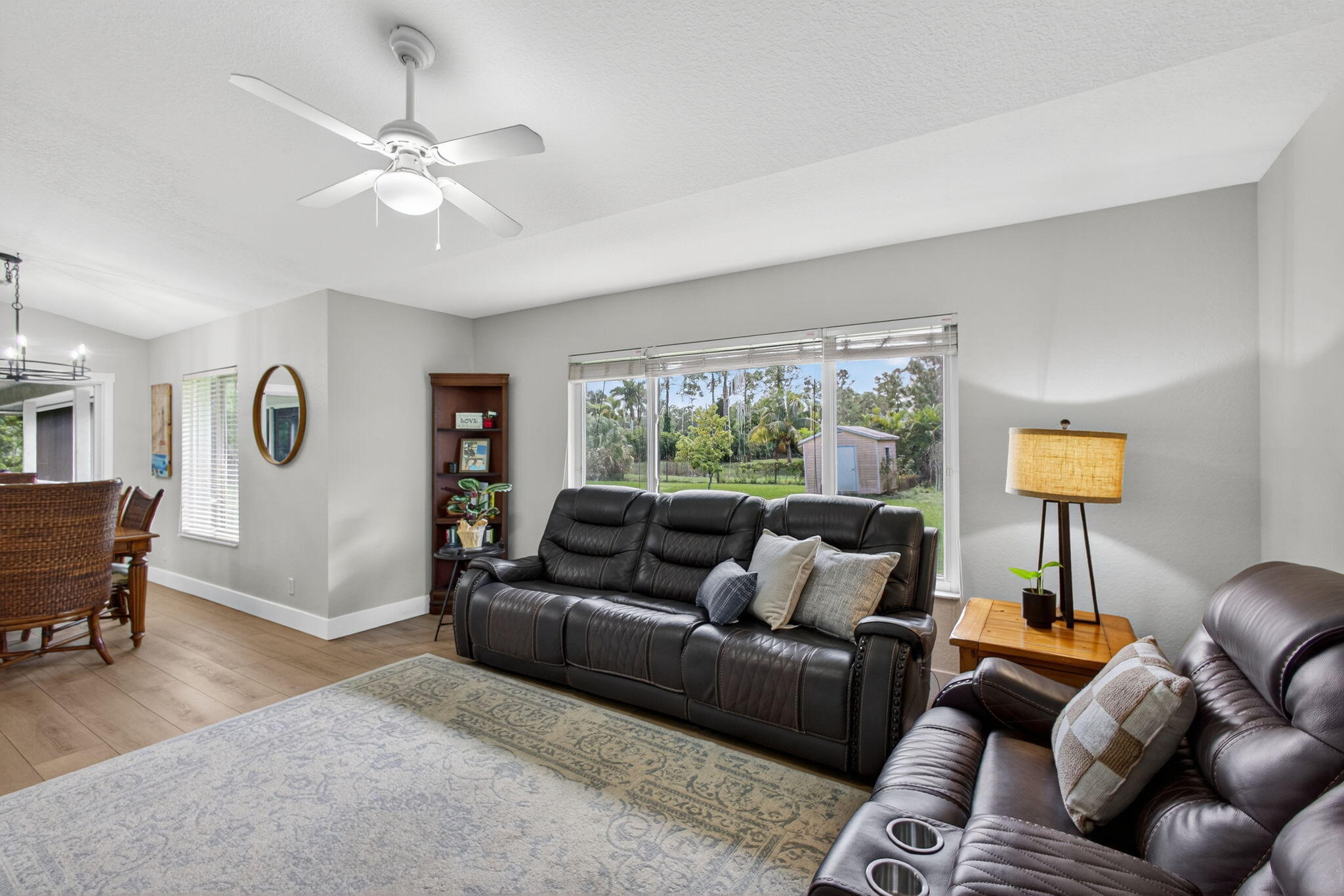 14366 76th Road North The Acreage, FL 33470 - Photo 28 of 76 a living room with furniture and a large window