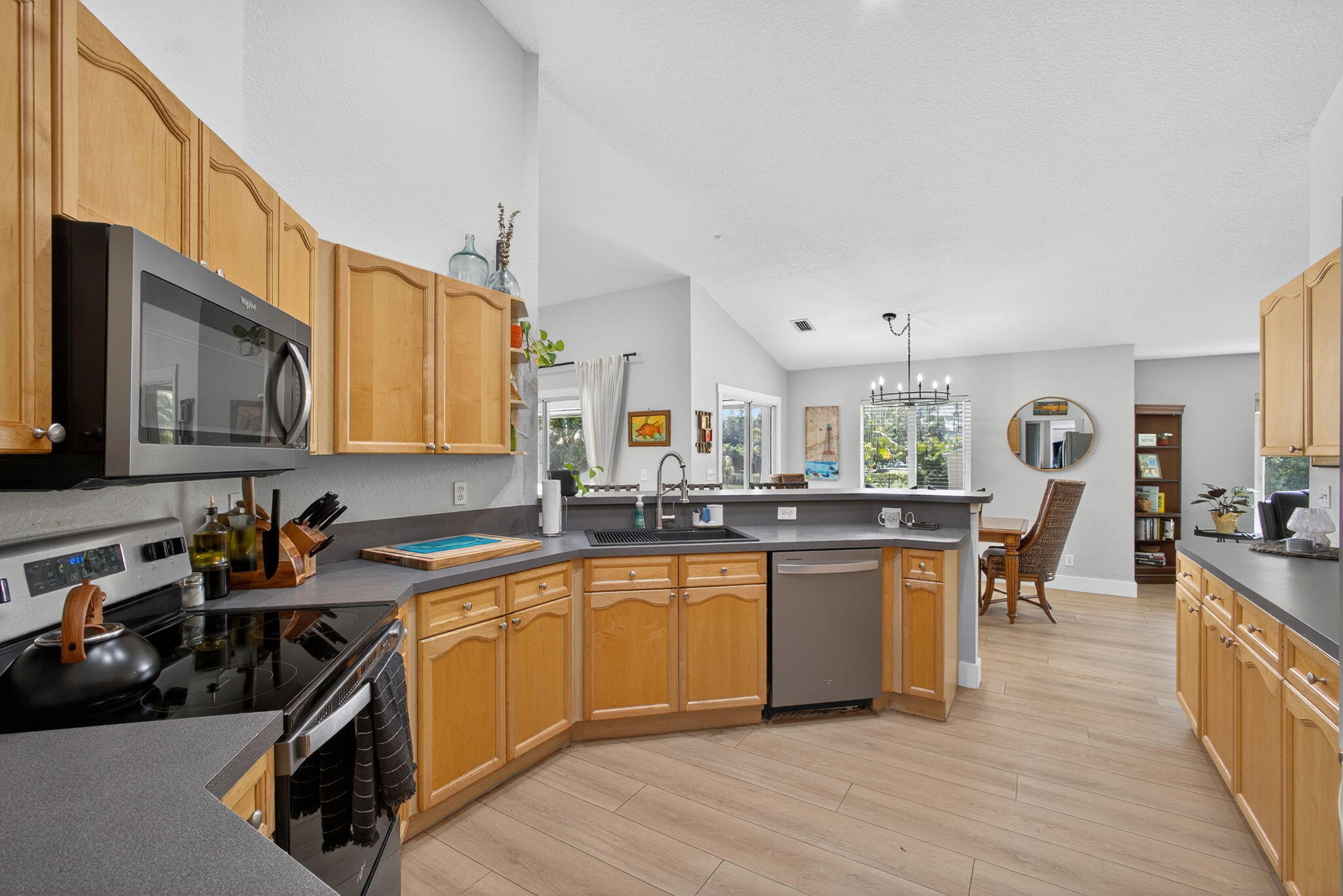 14366 76th Road North The Acreage, FL 33470 - Photo 33 of 76 a kitchen with a sink a counter top space and appliances