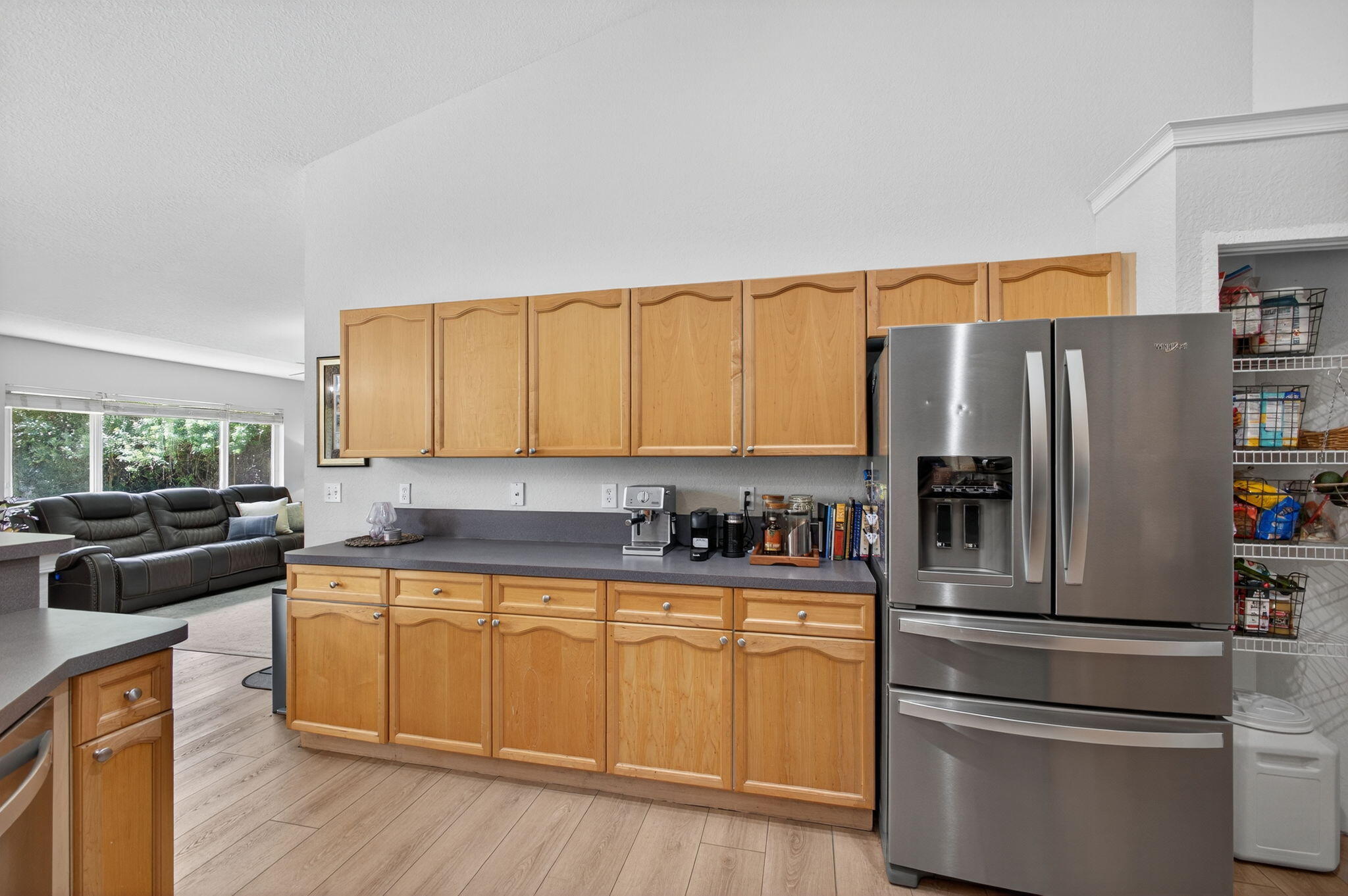 14366 76th Road North The Acreage, FL 33470 - Photo 35 of 76 a kitchen with stainless steel appliances a refrigerator and a stove top oven