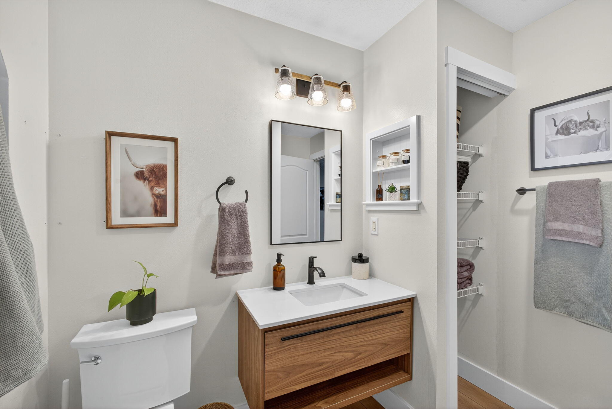 14366 76th Road North The Acreage, FL 33470 - Photo 36 of 76 a bathroom with a sink vanity mirror and toilet