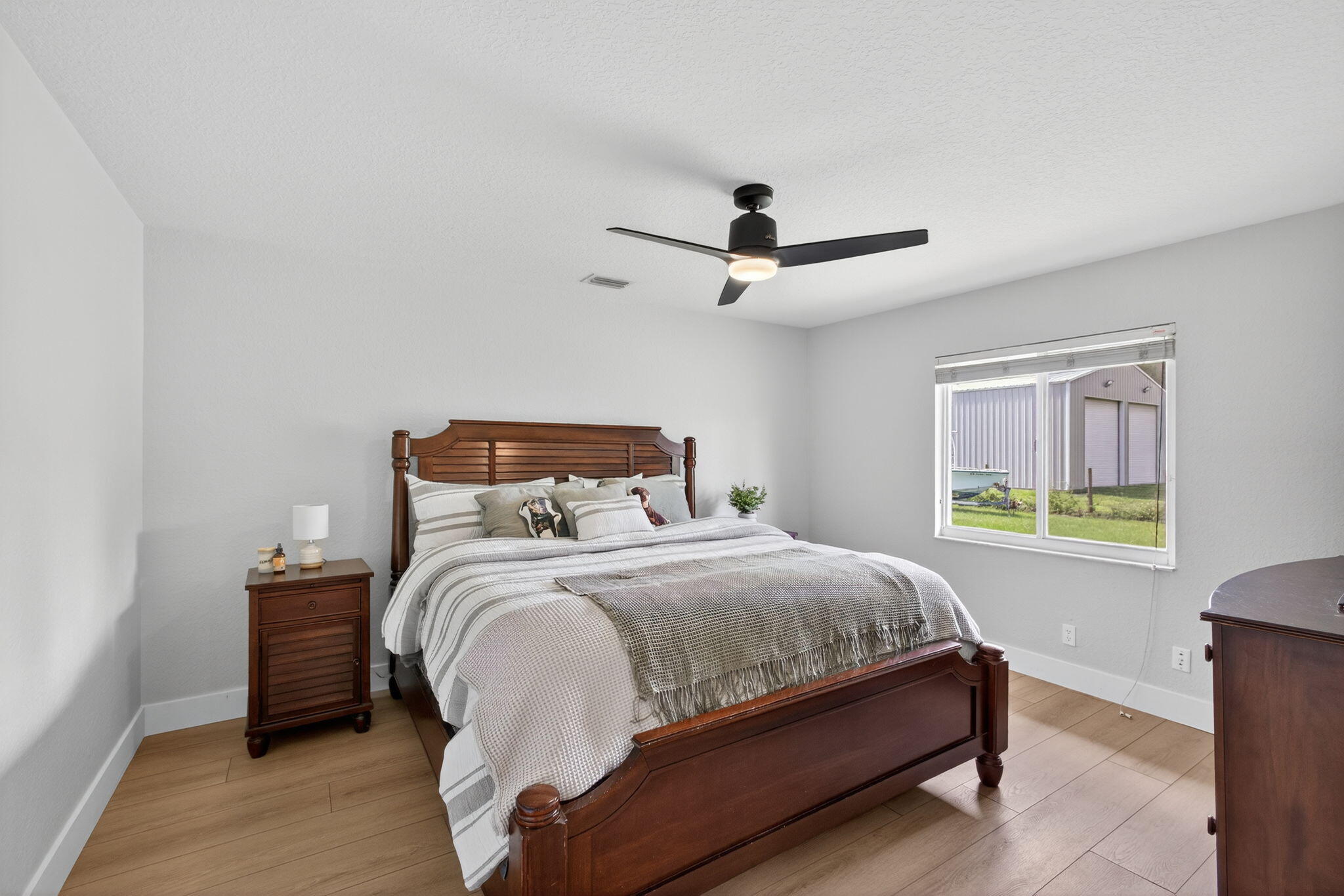 14366 76th Road North The Acreage, FL 33470 - Photo 38 of 76 a bedroom with a bed and a window