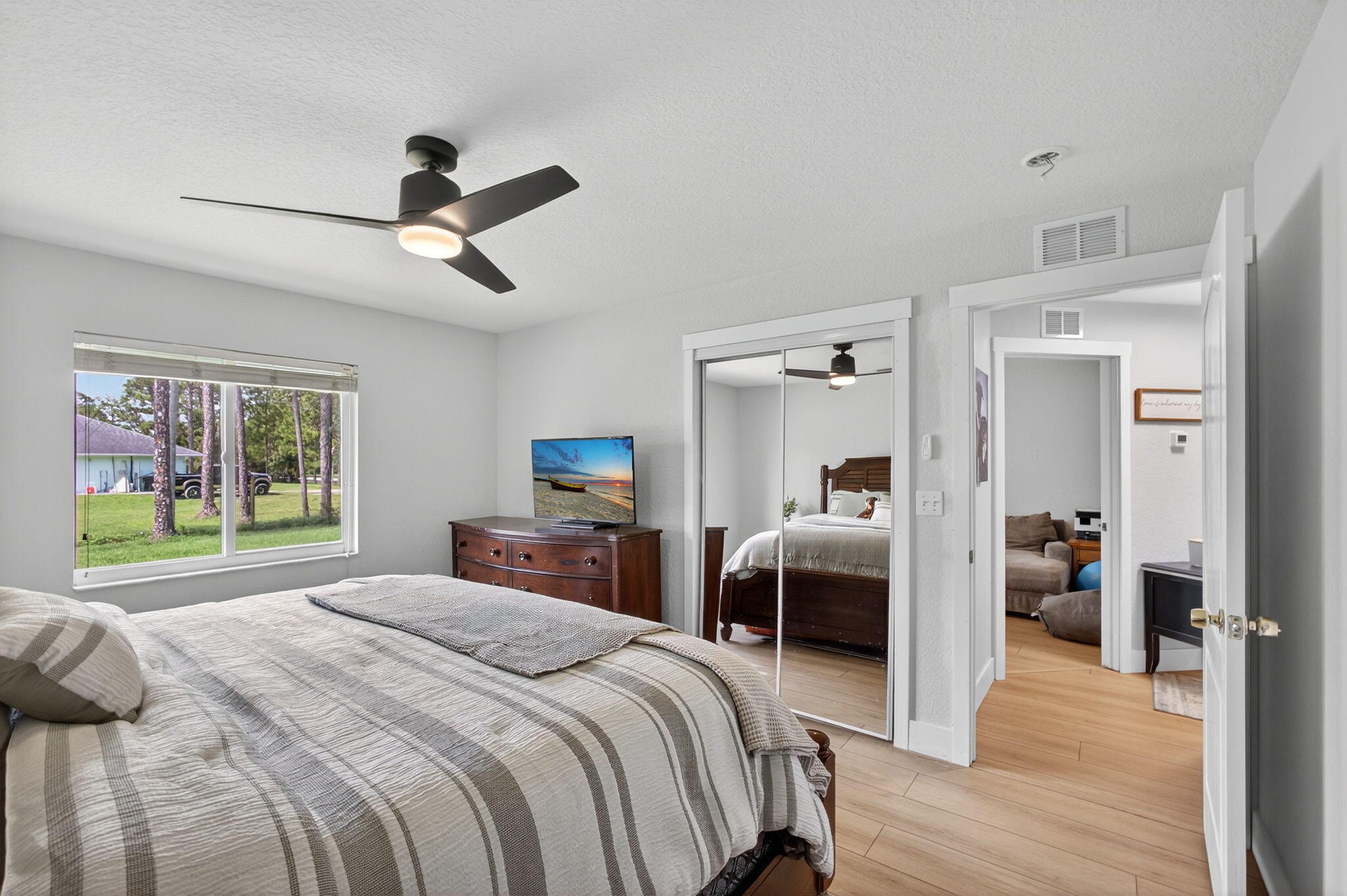 14366 76th Road North The Acreage, FL 33470 - Photo 39 of 76 a bedroom with a bed and a large window