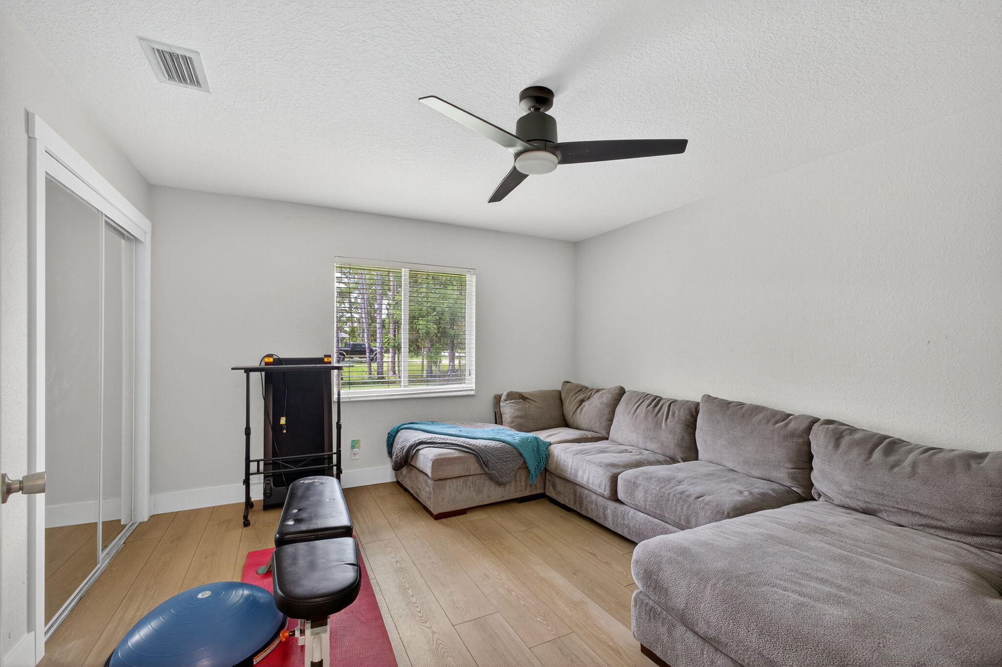 14366 76th Road North The Acreage, FL 33470 - Photo 40 of 76 a living room with furniture and a window