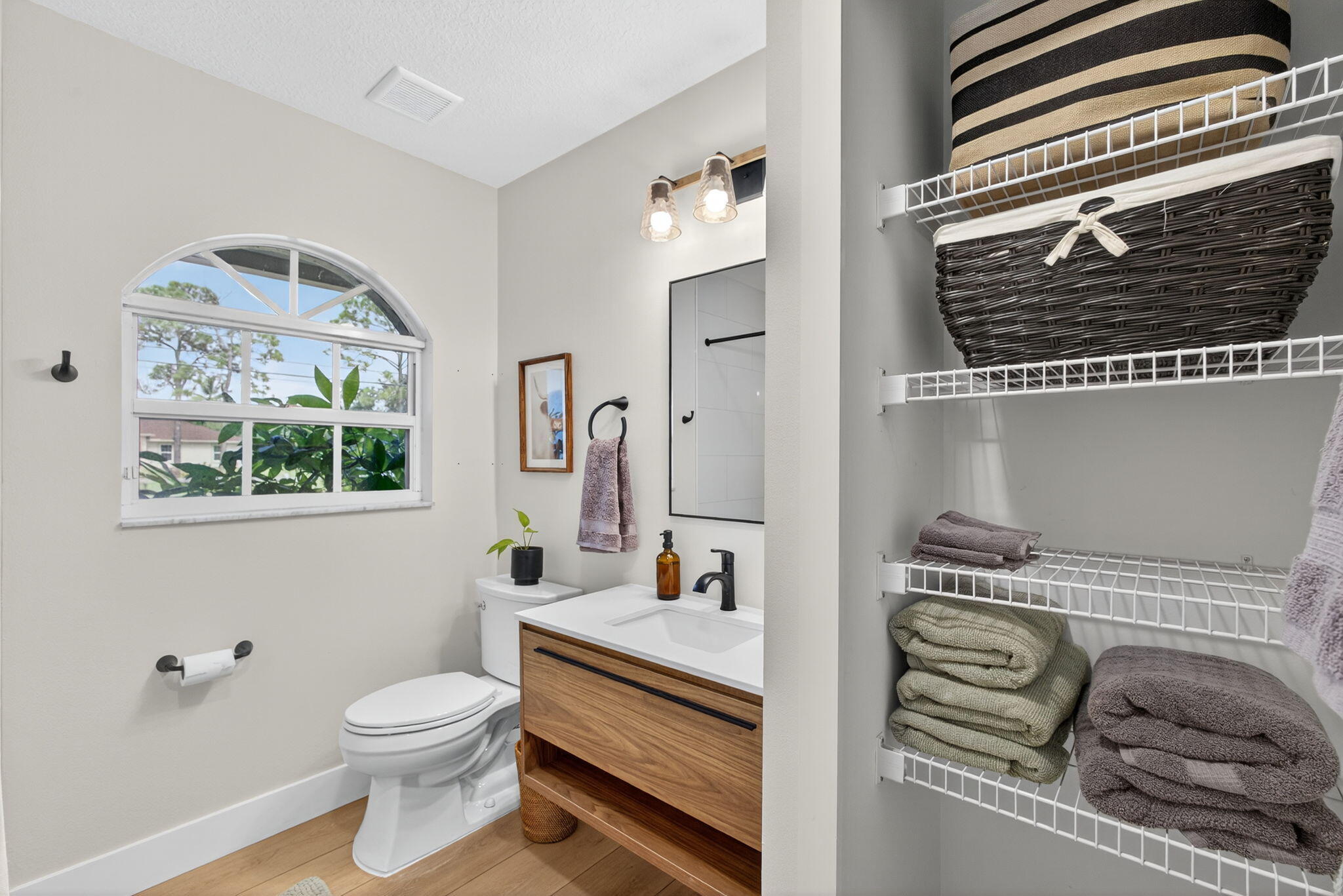 14366 76th Road North The Acreage, FL 33470 - Photo 42 of 76 a bathroom with a granite countertop toilet and a sink