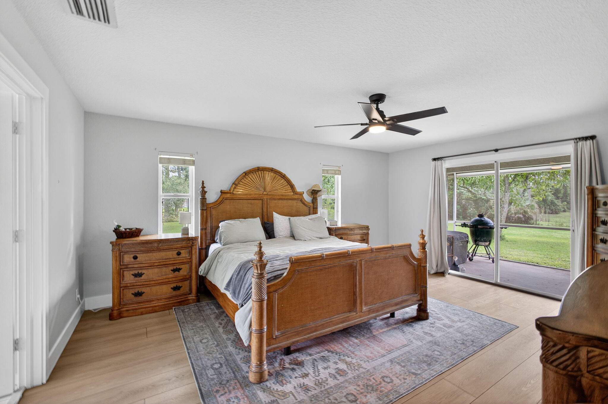 14366 76th Road North The Acreage, FL 33470 - Photo 44 of 76 a bed room with a bed and a large window