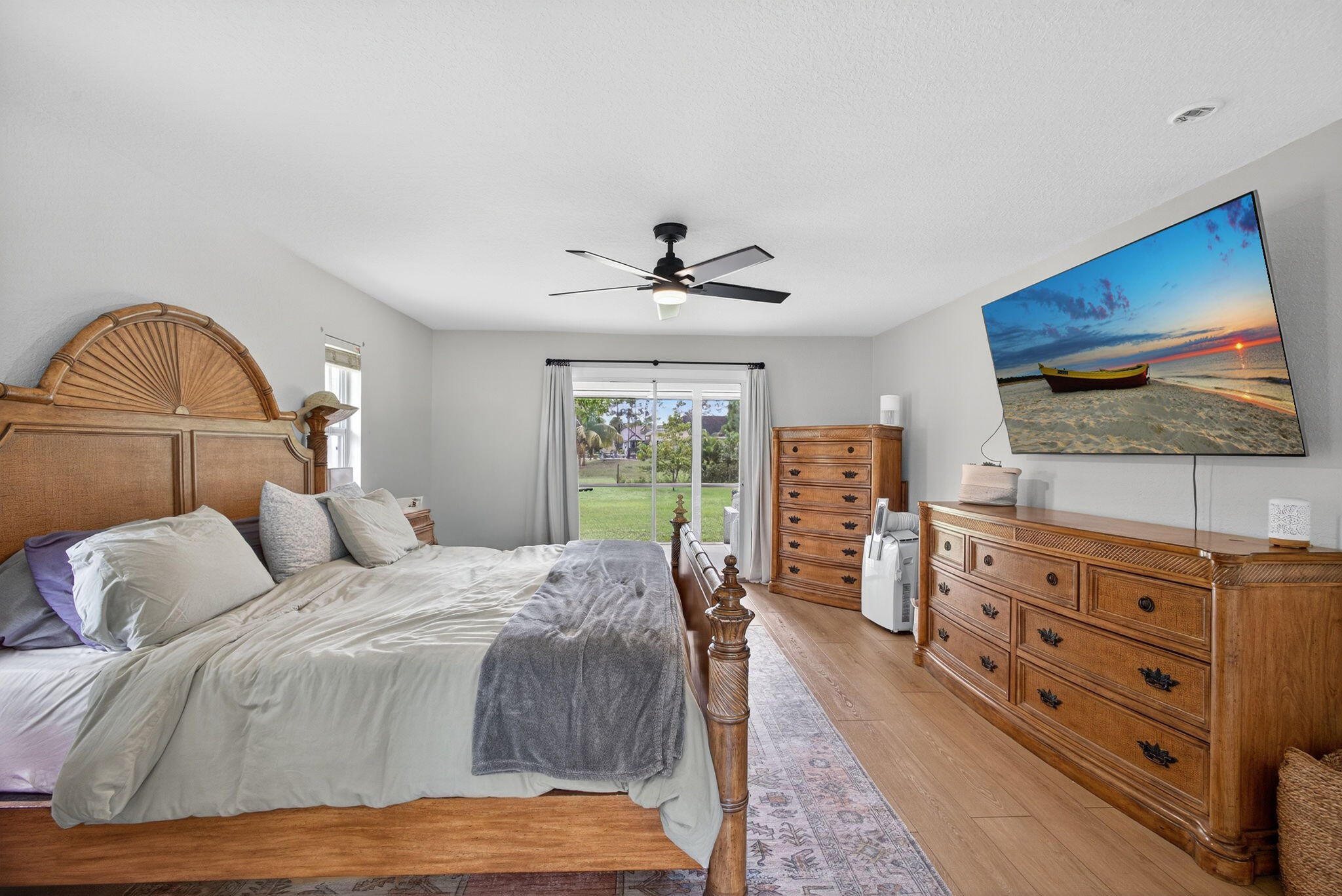 14366 76th Road North The Acreage, FL 33470 - Photo 45 of 76 a bedroom with a bed and a flat screen tv