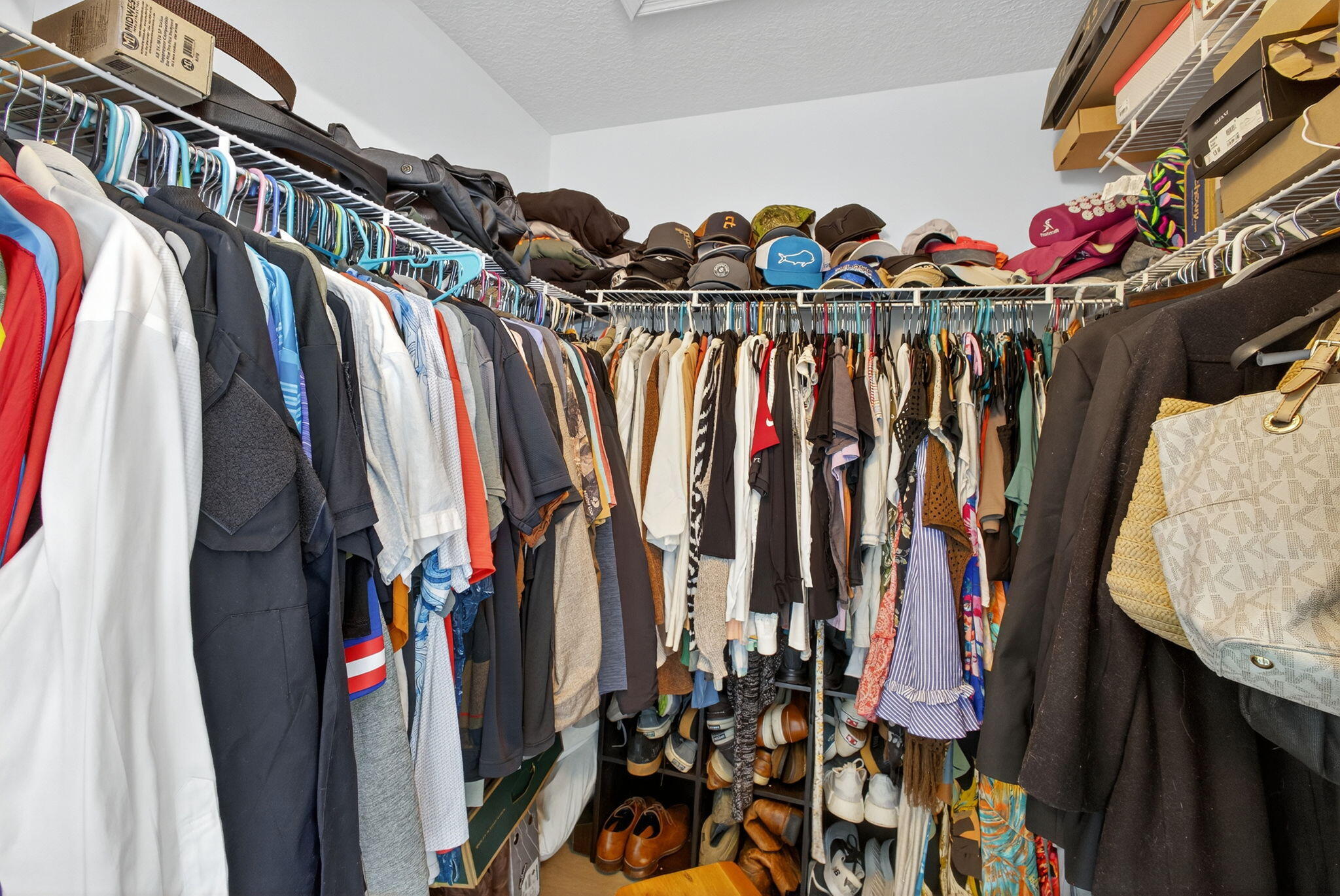 14366 76th Road North The Acreage, FL 33470 - Photo 49 of 76 a view of walk in closet with clothes