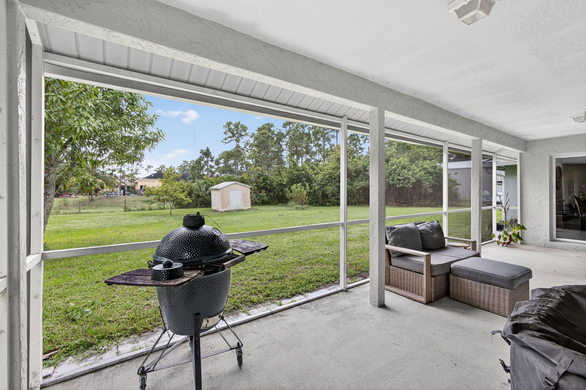 14366 76th Road North The Acreage, FL 33470 - Photo 51 of 76 a living room with garden and furniture