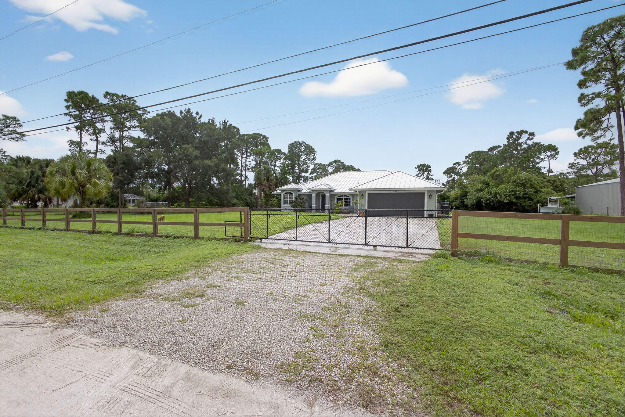 14366 76th Road North The Acreage, FL 33470 - Photo 6 of 76 a view of a bench in front of a building
